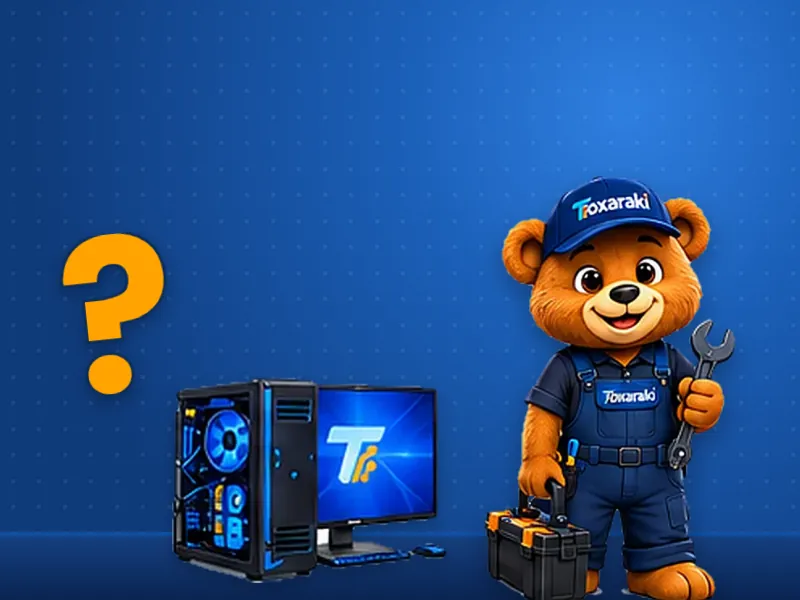 Toxaraki com uma chave inglesa pergunta o que é um PC, ao lado de um computador de mesa e de um ponto de interrogação.